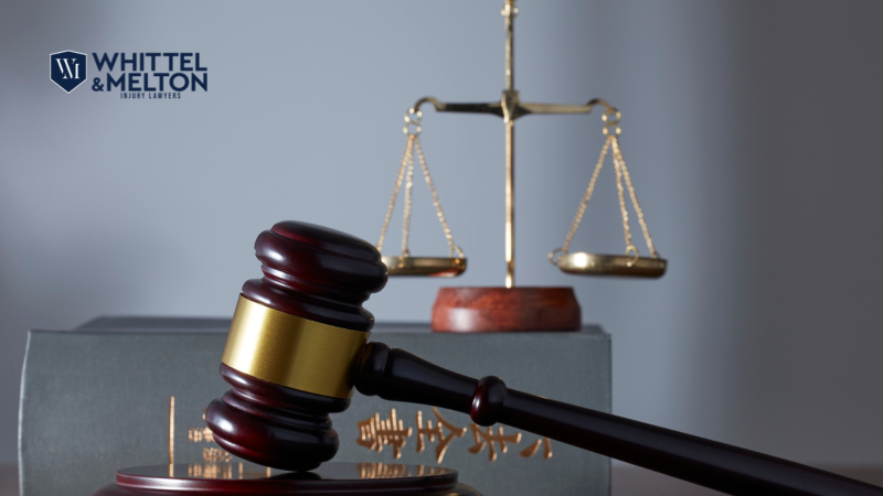 Judge's wooden gavel and brass scales of justice resting on a law book, symbolizing Miami felony criminal defense and South Florida multiple arrest defense by Whittel & Melton.