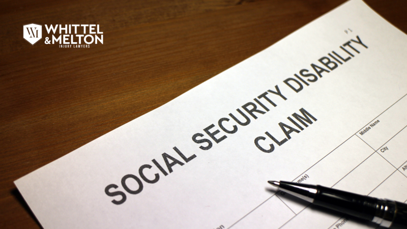 Close-up of a document titled "SOCIAL SECURITY DISABILITY CLAIM" with a pen resting on it, symbolizing SSDI application and legal help from Whittel & Melton Disability Lawyers.